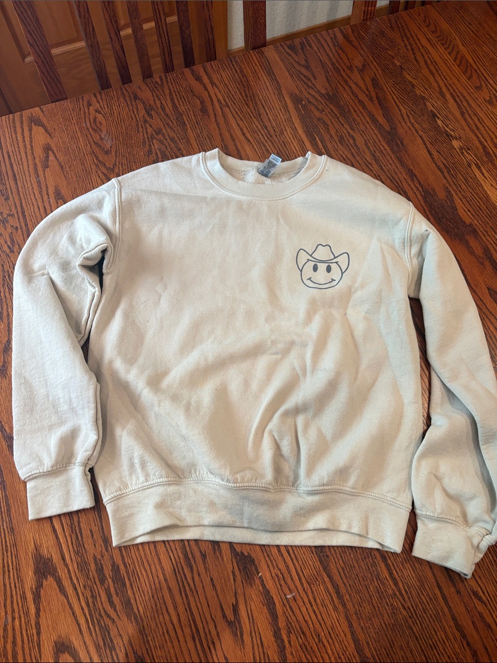 Cream Crewneck Sweatshirt with Cowboy Smile Graphic